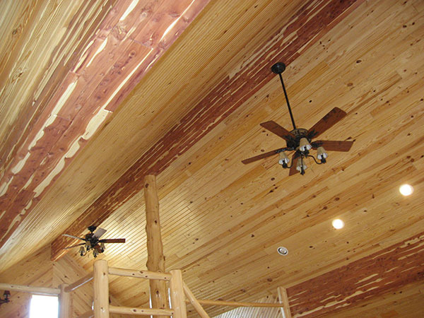 Cedar-wrapped beams inside custom cabin