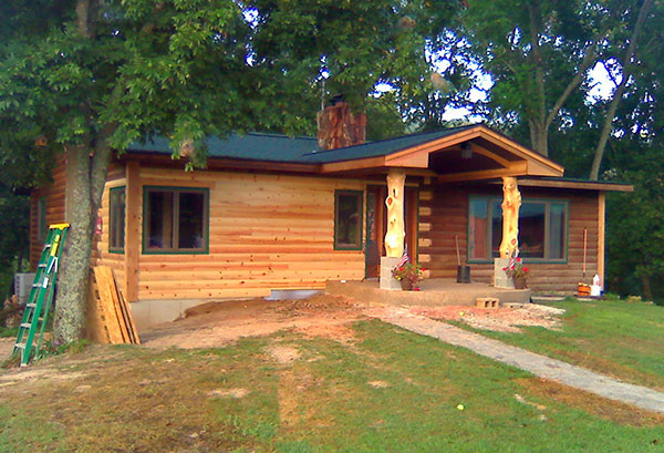 10. Log home addition with local cedar front porch support posts