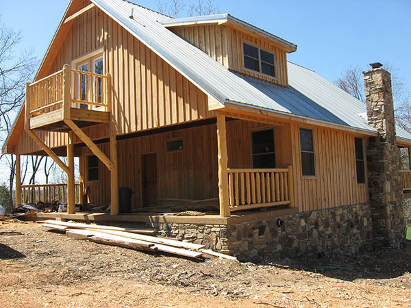 Custom home with cedar log posts