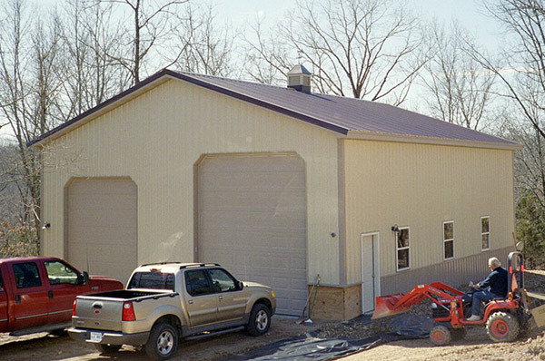 Framed garage with overhead doors